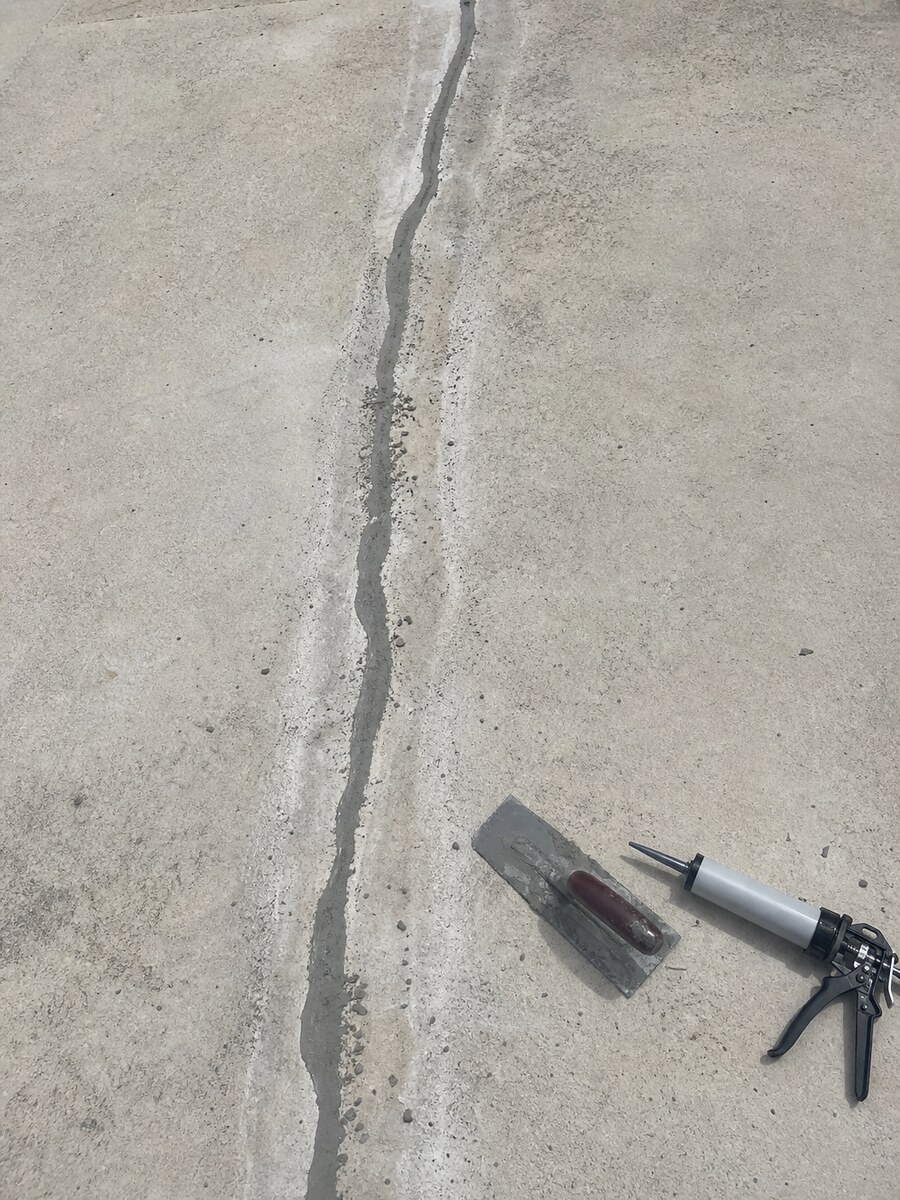 Concrete crack being prepared and filled during a repair visit in Martin County